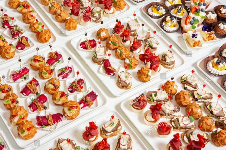stock photo catering buffet or service with different snacks appetizers and canapes on a table variety of 2587289643 e1769370213167